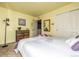 Bright bedroom with double bed, dresser, and mirrored closet doors at 5286 Tall Spruce St, Brighton, CO 80601