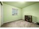 Simple bedroom with window, carpet flooring, and built-in shelving at 5286 Tall Spruce St, Brighton, CO 80601