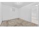 Empty basement room with carpeted floor and neutral walls at 4422 Lincoln St, Denver, CO 80216