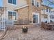 Stone and brick patio with fire pit and seating area at 199 Whitehaven Cir, Highlands Ranch, CO 80129