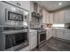 Modern kitchen features stainless steel appliances and white cabinetry at , Aurora, CO 80019