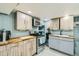 Finished basement kitchenette with wood cabinets at 7321 Carnation Pl, Commerce City, CO 80022