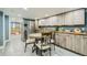 Eat-in kitchen with table and chairs in finished basement at 7321 Carnation Pl, Commerce City, CO 80022