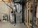 Unfinished basement with HVAC and water heater at 14068 Harrison St, Thornton, CO 80602