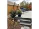 Steps leading up to a backyard deck surrounded by landscaping at 14068 Harrison St, Thornton, CO 80602