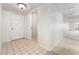 Bright condo entryway with tiled floor and access to other rooms at 7000 E Quincy Ave # 204, Denver, CO 80237