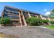 Exterior view of Dayton Green condo building, showcasing its architecture at 7000 E Quincy Ave # 204, Denver, CO 80237