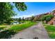 Landscaped grounds with pond and walking path near condo building at 7000 E Quincy Ave # 204, Denver, CO 80237