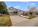 Two-story house with attached garage and landscaping at 12030 Song Bird Hills St, Parker, CO 80138