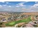 Aerial view of a neighborhood with a golf course at 1199 Links Ct, Erie, CO 80516