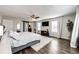 Primary bedroom with a large bed and sliding barn door at 1786 Quartz St, Castle Rock, CO 80109