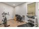 Home office with treadmill, exercise bike, and built-in desk at 1468 S Washington St, Denver, CO 80210