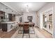 Open concept dining area with kitchen access and patio doors at 1468 S Washington St, Denver, CO 80210