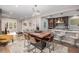 Open concept dining area with kitchen access and view of living room at 1468 S Washington St, Denver, CO 80210