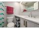 Full bathroom with a toilet, sink, and shower/tub combo at 1468 S Washington St, Denver, CO 80210