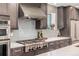 Stainless steel range and modern cabinetry in this updated kitchen at 1468 S Washington St, Denver, CO 80210