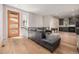 Open living area with a sectional sofa and view into kitchen at 1468 S Washington St, Denver, CO 80210