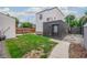 Private backyard with grass, shed, and walkway at 1468 S Washington St, Denver, CO 80210