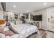 Open studio apartment with bed, kitchen, and TV at 1468 S Washington St, Denver, CO 80210
