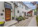 Modern home exterior with orange door and patio area at 1468 S Washington St, Denver, CO 80210