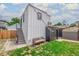 Modern backyard with a shed, stairs to the upper level, and a bench at 1468 S Washington St, Denver, CO 80210
