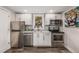 Modern studio kitchen with stainless steel appliances at 1468 S Washington St, Denver, CO 80210