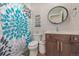 Clean bathroom with teal shower curtain and modern vanity at 1468 S Washington St, Denver, CO 80210