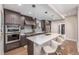 Modern kitchen boasts stainless steel appliances and ample counter space at 1468 S Washington St, Denver, CO 80210