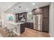 Modern kitchen with stainless steel appliances and island seating at 1468 S Washington St, Denver, CO 80210