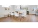 Dining area with a rustic wood table and white chairs at 1339 E 131St Dr, Thornton, CO 80241