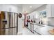 Modern kitchen with stainless steel appliances and granite countertops at 730 E Alameda Ave, Denver, CO 80209