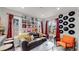 Living room with a retro vibe, featuring a brown couch and vinyl records at 730 E Alameda Ave, Denver, CO 80209