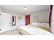 King bedroom with lots of natural light and gray walls at 730 E Alameda Ave, Denver, CO 80209