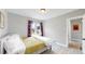King bedroom with gray walls, and access to a bathroom at 730 E Alameda Ave, Denver, CO 80209