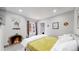Bright bedroom with a fireplace and a comfortable bed at 730 E Alameda Ave, Denver, CO 80209