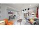 Living room with a modern aesthetic, featuring a comfy couch and large TV at 730 E Alameda Ave, Denver, CO 80209