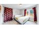 King bedroom with two windows and lots of natural light at 730 E Alameda Ave, Denver, CO 80209