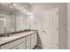 Double vanity bathroom with a shower at 460 Millwall Cir, Castle Pines, CO 80108