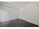 Bright and airy bedroom with concrete floors and neutral walls at 3149 Blake St # 101, Denver, CO 80205