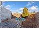 Cozy patio with string lights, seating, and gravel at 8224 Washington St # 12, Denver, CO 80229