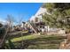 Back of house with deck, stairs, and landscaping at 21506 E Wanderlust Pl, Parker, CO 80138