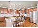 Gourmet kitchen with granite countertops and stainless steel appliances at 21506 E Wanderlust Pl, Parker, CO 80138