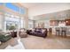 Gathering room with open concept to kitchen and hardwood flooring at 21506 E Wanderlust Pl, Parker, CO 80138