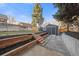 Landscaped backyard with patio and detached garage at 785 S Ogden St, Denver, CO 80209