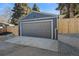 Detached garage with gray exterior and a large door at 785 S Ogden St, Denver, CO 80209