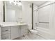 Modern bathroom with gray vanity, hexagon tile floor, and tub shower at 2876 W 53Rd Ave # 319, Denver, CO 80221