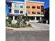 Modern building exterior with orange and gray accents at 2876 W 53Rd Ave # 319, Denver, CO 80221