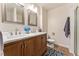 Updated bathroom with double sinks and a large vanity at 904 S Oakland Ct, Aurora, CO 80012