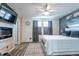 Spacious bedroom with a king-size bed and fireplace at 16090 E 53Rd Ave # 28, Denver, CO 80239