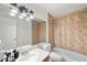 Clean bathroom with tub, shower, and vanity at 10150 E Virginia Ave # 2-205, Denver, CO 80247